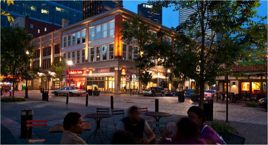 Pittsburgh's Market Square keeps the cobblestone street on the same plane as the sidewalk cafés on the perimeter and the plaza in the middle, indicating to drivers, "you're not on a highway anymore." Photo: Strada, LLC
