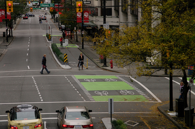 The separated bike lane on Dunsmuir Street in Vancouver received the first generation of the city's intersection treatments. Photo: ##https://www.flickr.com/photos/pwkrueger/5133829565/in/photostream/##Paul Krueger/flickr##