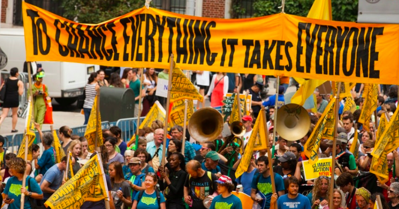 A protesters gathered in New York City to demand action on climate, a new report shows exactly what that action could offer us. Photo: South Bend Voice via Flickr