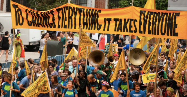 A protesters gathered in New York City to demand action on climate, a new report shows exactly what that action could offer us. Photo: South Bend Voice via Flickr