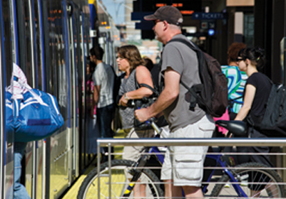 Despite its slow travel time, the Twin Cities' Green Line is surpassing expectations -- in part because the FTA underestimates the university effect. Photo: ##http://www.cts.umn.edu/Publications/catalyst/2014/july/greenline##U of M Center for Transportation Studies##
