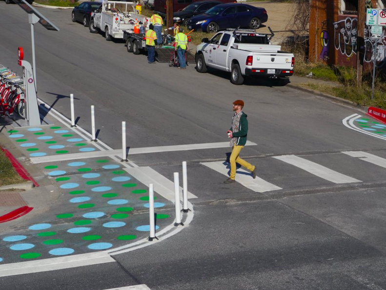 This new painted polka-dot intersection bumpout was design to make a dangerous intersection safer and more comfortable for pedestrians. Photo: Austin Mobility
