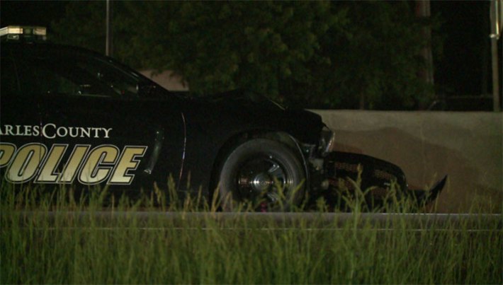 This photo of the aftermath of a fatal pedestrian crash shows the police cruiser was outfitted with a bull bar, which appears to have fallen off but looks undeformed. Photo: KMOV