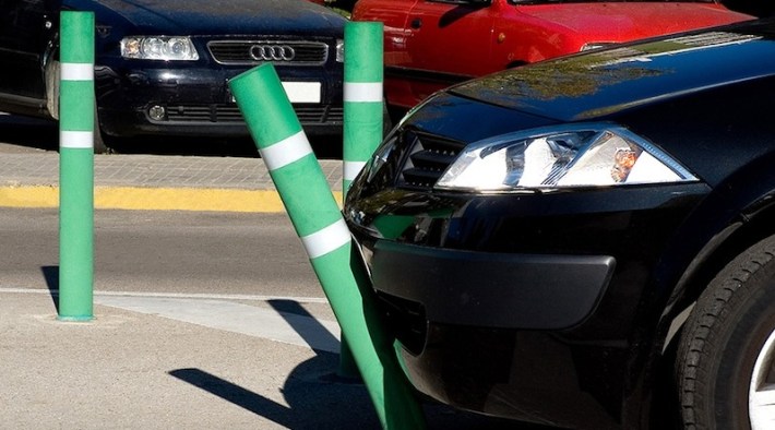 The fact that a driver can bend a plastic bollard without damaging their car is a feature, not a bug — and it's a huge issue for the safety of vulnerable road users. Source: Creative commons.