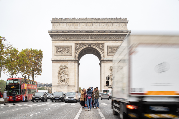 Pedestrians huddle to take selfies on an unprotected median along the Champs-Élysées. Image: Salem Mostefaoui via PCA-STREAM.