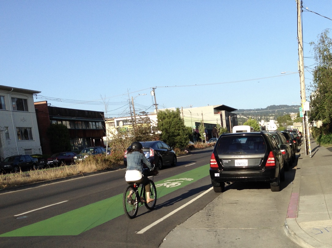 Even when the shared lane is painted green, cyclists tend to still ride in the "door zone." Photo: PeopleForBikes